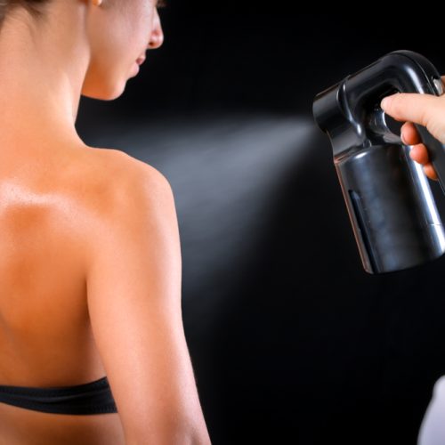 Woman,Body,Paint,With,Airbrush,In,Professional,Beauty,Salon