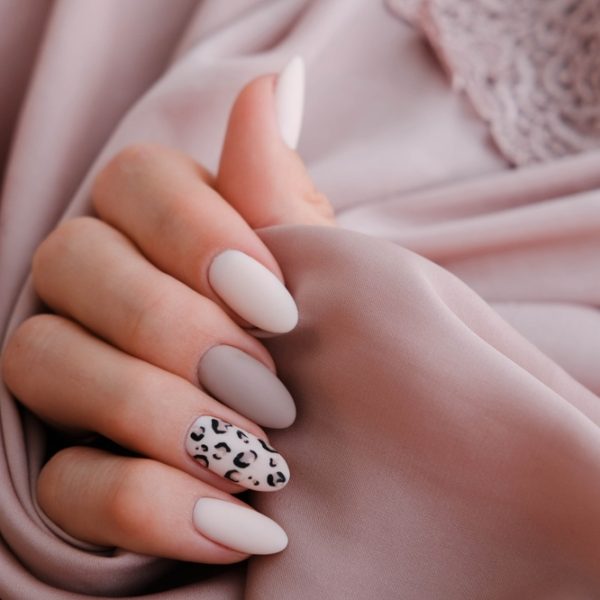 Woman's,Hand,With,A,Beautiful,Oval-shaped,Manicure.,Autumn,Trend,,Beige