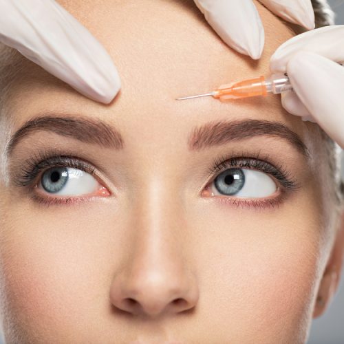 Portrait,Of,Young,Caucasian,Woman,Getting,Cosmetic,Injection,Of,Botox